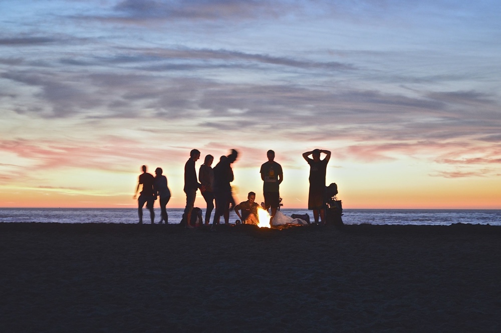 Young Adults Camp Fire on Beach Image